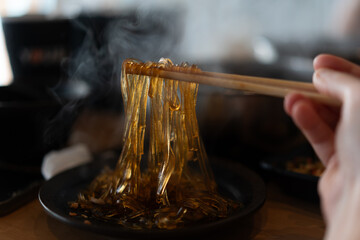 hot cooked glass noodle shabu with chopsticks