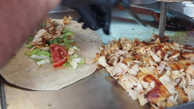 preparing doner chicken wrap at instanbul street 