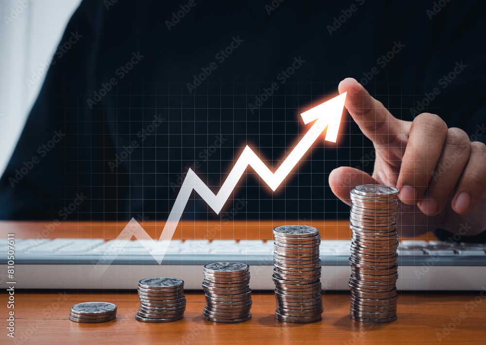 Aufkleber growing up volatility arrow draw by businessman hand on coins stacked as bar graph chart steps on on