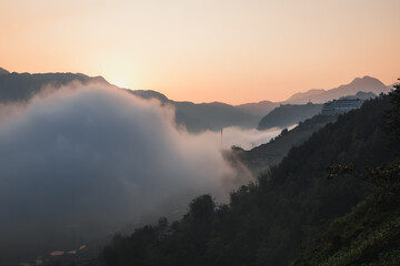 Fototapeta premium Mist rolling in up the side of a mountain