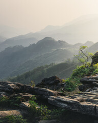 A view of a mountain in the morning mist