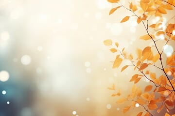 Dry Yellow Leaves and Tree Branches on Blue and Orange Gradient Blur Bokeh Background. Copy Space for Autumn Banner or Poster