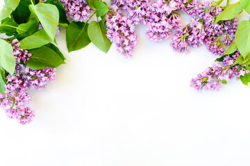Lilac flowers on white background. Spring flowers. Floral composition, Flat lay, top view, copy...