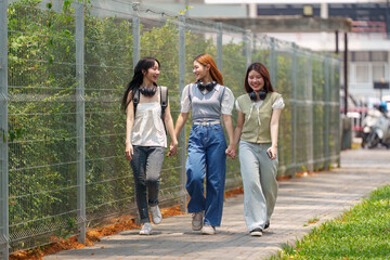 Asian teenage student and friends talking and enjoying at university. back to school concept