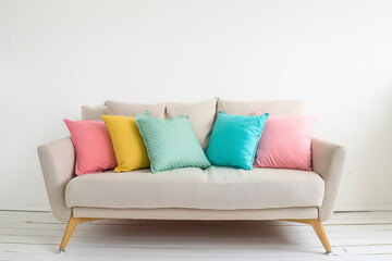 Colorful pillows on sofa in the living room at home. Blue sofa on wooden floor against white wall with copy space