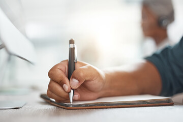 Business person, hands and writing with notebook for planning, schedule or reminder on desk at office. Closeup of employee, accountant or financial advisor taking notes in diary for task at workplace