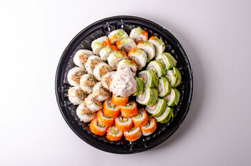 sushi set on a white plate, sushi rolls
