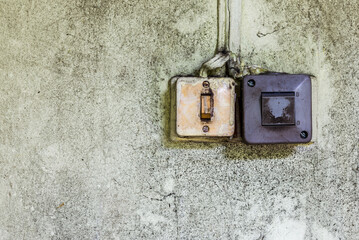 Two Old Plastic Light Switches On A Grunge Dirty Wall