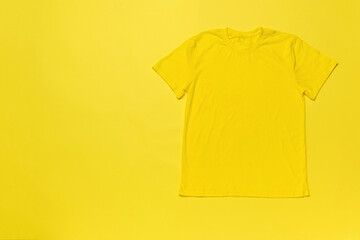 Classic yellow T-shirt on a yellow background.