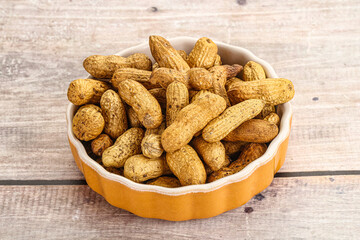 Raw ripe unpeeled peanut heap