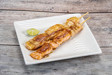 Grilled salmon skewer with sauce