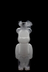 Plastic teddy bear bottle filled with swirling mist and fog creating strange effects shapes and textures