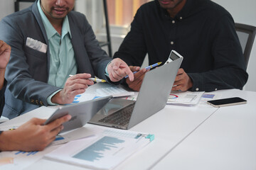 Business idea. Business people talking And calculations about charts and graphs showing the growth of investment results Of successful teamwork