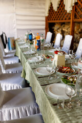 Banquet hall, set table, beautiful dishes and food