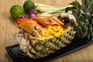 Rice with seafood in pineapple