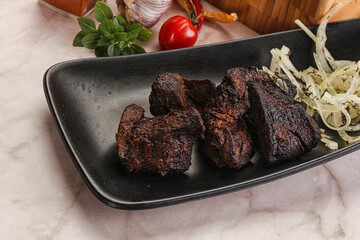 Grilled beef barbecue served onion