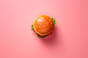 Burger top view on pink background