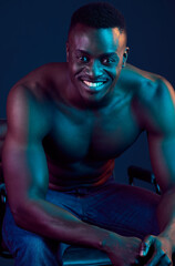 Fototapeta na wymiar Neon, fitness and portrait of black man in studio for training, exercise and bodybuilder workout. Sports, athlete and happy person in aesthetic lighting for wellness, healthy body and lose weight