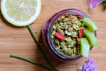 Yogurt parfait with matcha granola and chia seeds berry jam  