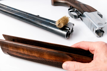 incomplete disassembly of a hunting double-barreled shotgun before cleaning