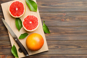 fresh Fruit grapefruit slices on colored background. Top view. Copy Space. creative summer concept....