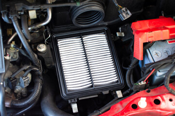 New car air filter , air filter on filter box in a engine compartment of car , Car maintenance concept