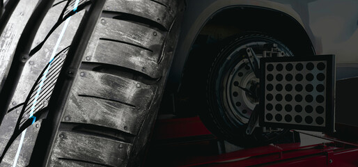 Car tire tread and car wheel alignment at the auto repair shop , double exposure , Car maintenance...