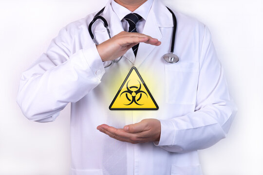 Doctor holds a sign of radiation. The concept of radiation risk.