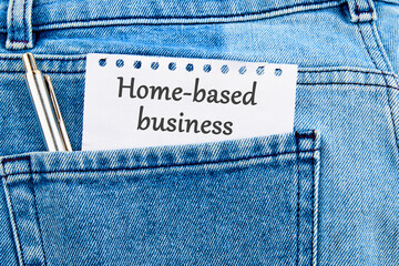 Text Home based business on a piece of paper that appeared from the pocket of jeans
