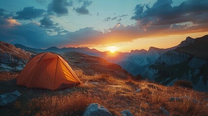 The Camping tent in the mountain valley can see sunrise in the morning.