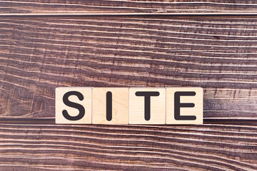 SITE word made with wood building blocks