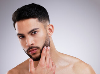 Portrait, skincare and natural beauty of man grooming in studio isolated on white background....