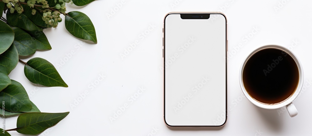 Poster a white table holds a phone mockup accompanied by a cup of coffee and leaves for a more visually app