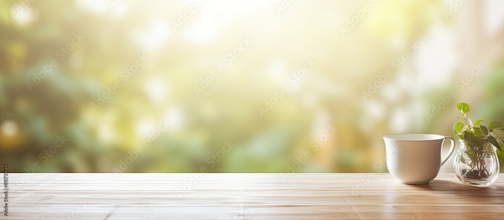Poster The table has a free space background and a blurred window in the background providing a decorative and sunny day copy space image