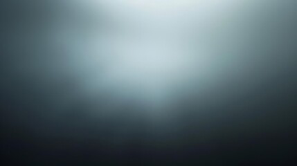 Obraz premium The image is a dark, abstract background with a glowing light in the center. It could be used as a background for a website or app, or as a backdrop for a presentation.