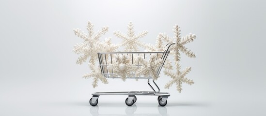 A copy space image featuring white wooden snowflake figures arranged in a supermarket cart