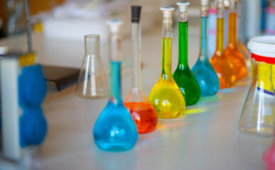 Flasks and test tubes with multi-colored chemical liquids in a laboratory in a clinic. Testing,...