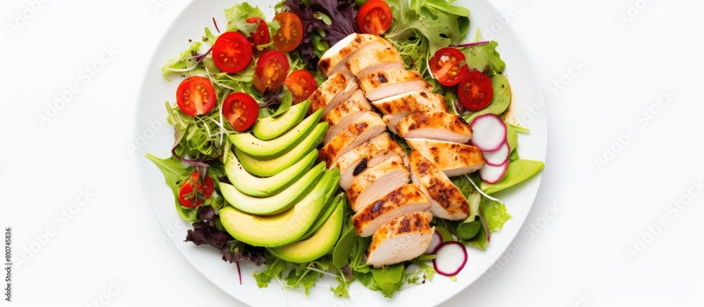 Poster A healthy lunch featuring grilled chicken fillet and vegetable salad topped with avocado photographed from above with a white background The image provides empty space for text or other additions