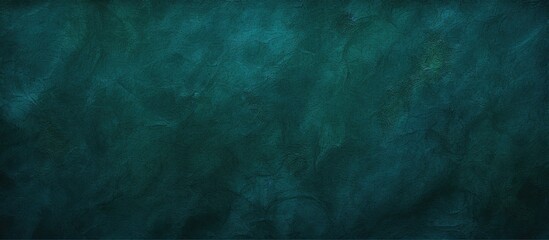 A visually appealing dark petrol green blue texture background ideal for graphic design with plenty...