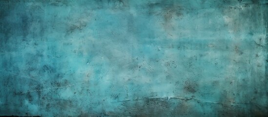 Fototapeta premium An abstract grunge background with a vignette showcasing a cyan decorative plaster texture Ideal for design purposes with copy space available