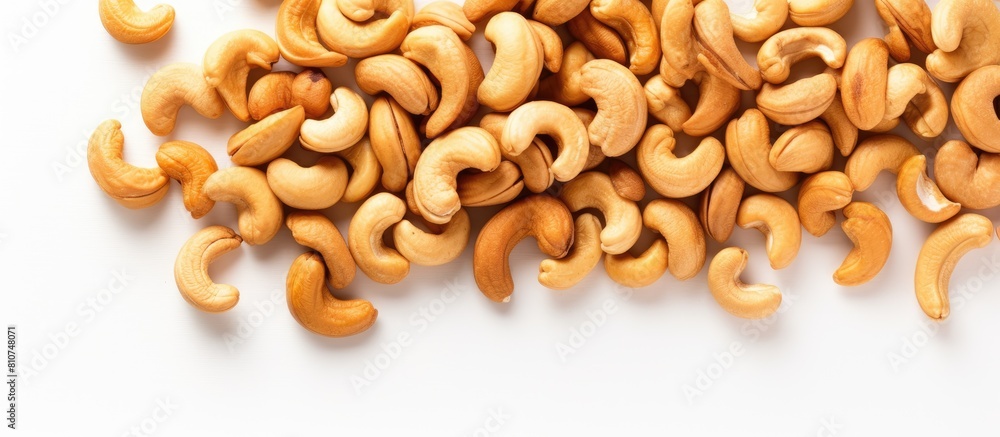 Aufkleber A pile of cashew nuts on a white background seen from above with empty space for additional elements