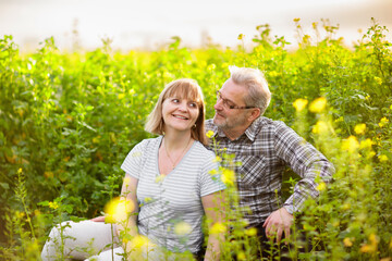 Elderly couple in blooming garden