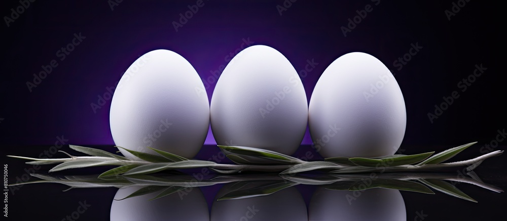 Aufkleber A view from above shows three white Easter eggs resting on a dark background with lavender creating a visually appealing copy space image