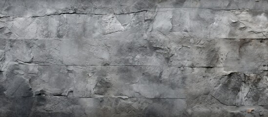 Obraz premium Aged and rugged granite texture in the backdrop resembling a natural combination of cement and stone Providing a copy space image with a banner like appearance complemented by a grungy concrete wall