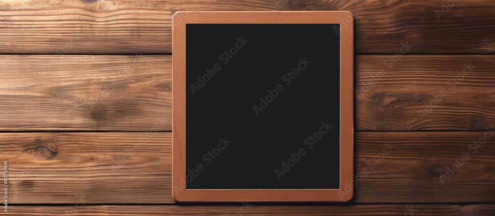 Fototapete the digital tablet computer is placed on a wooden background with a screen that has been isolated an