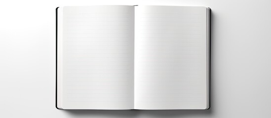 A photograph displaying a blank notebook placed on a white background with sufficient empty space for addition of content or images. Creative banner. Copyspace image