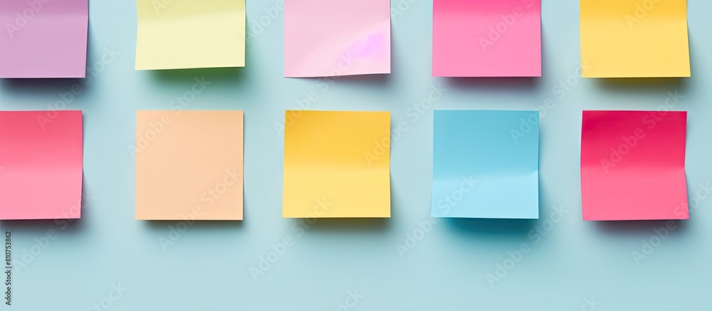 Leinwandbilder A minimal style flat lay with colorful sticky notes on a pastel background The image provides ample copy space and is captured from a top view
