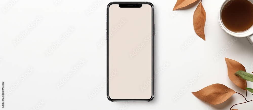 Poster a phone mockup rests on a white table accompanied by a cup of coffee and leaves creating a visually 