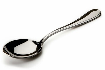 Classic metal spoon with a polished finish, isolated on a pure white background