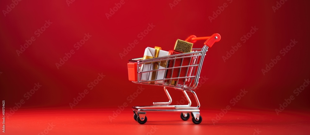 Poster christmas themed shopping cart toy on a red background copy space image with discounts and sale